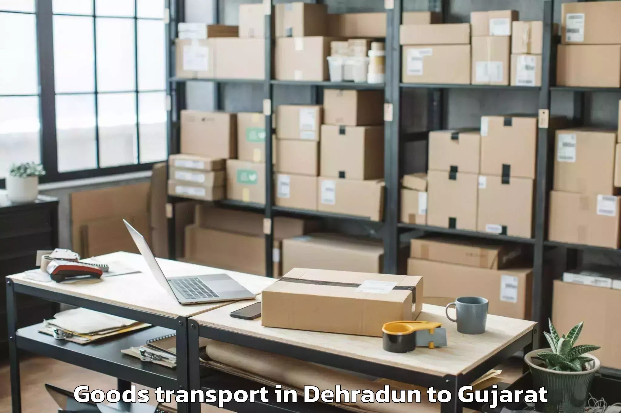 Affordable Dehradun to Koyali Goods Transport